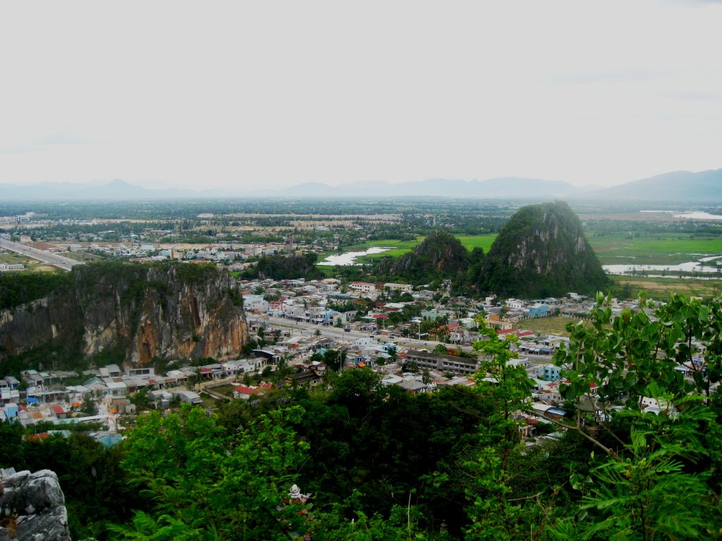 Mountains surrounded by tiny houses looked from a top view